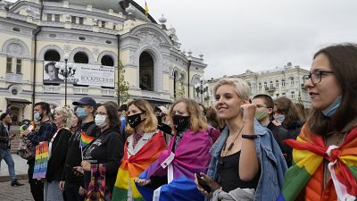 People take part in the annual Gay Pride parade, under the protection of riot police in Kyiv, Ukraine.