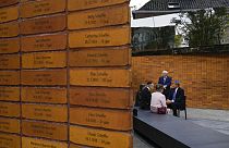  King Willem-Alexander, right, talks to Holocaust survivors and relatives after unveiling the new monument in Amsterdam's historic Jewish Quarter