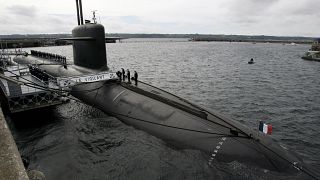 In this July 13, 2007 picture, French Marine officers wait atop "Le Vigilant" nuclear submarine at L'Ile Longue military base, near Brest, Brittany.