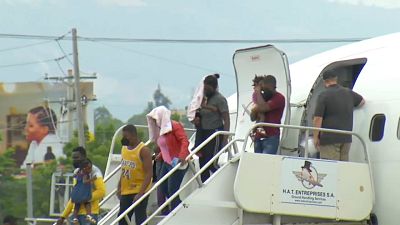 Migrantes haitianos chegam a Port-au-Prince