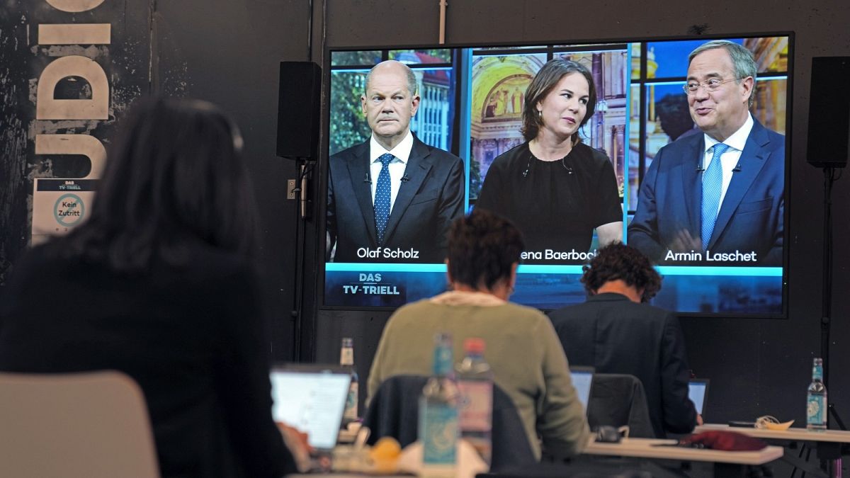 German general election candidates Olaf Scholz, left, Annalena Baerbock, center, and Armin Laschet, right, in a televised debate - Sunday Sept. 19, 2021