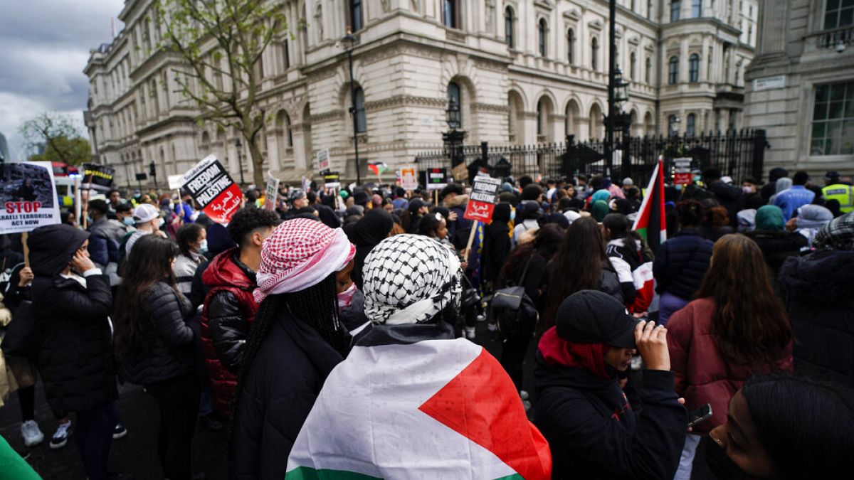 People gather outside Downing Street to protest against Israeli attacks on Palestinians in Gaza, in London, Saturday, May 15, 2021
