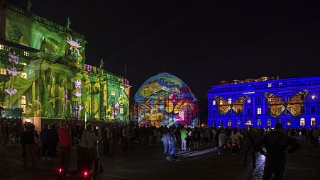 People gather on Bebelplatz for the "Festival of Lights" in Berlin, September, 2021.