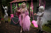 Daisy the Drag Queen Gardener performs at the Chelsea RHS Flower Show in London, Monday, Sept. 20, 2021.
