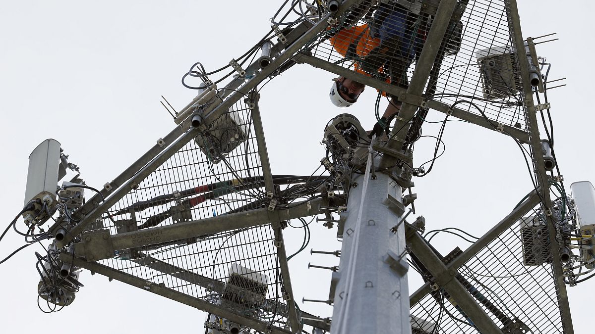 An operator performs maintenance on a phone masts, May 22, 2017 in High Ridge, Mo. 