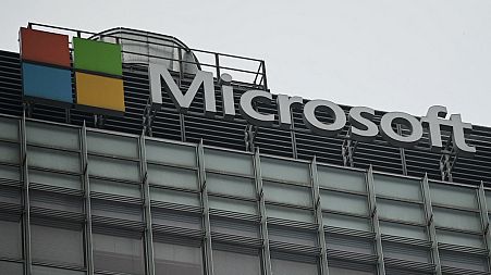 The Microsoft logo is seen at its local headquarters in Beijing on July 20, 2021.