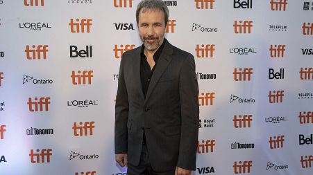 Director Denis Villeneuve walks the red carpet as he promotes his film "Dune" during the Toronto International Film Festival, on Saturday, Sept. 11, 2021, in Toronto