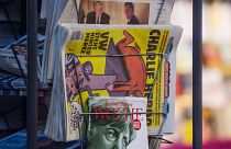 Copies of the French satirical magazine Charlie Hebdo sit at a newsagent's in Stuttgart.