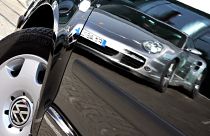 Oct 27, 2007 file picture shows a Porsche sports car. reflected in the door of a Volkswagen compact car in Frankfurt, Germany.