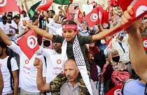 Demonstrators attend a protest against Tunisian President Kais Saied in Tunis on September 26