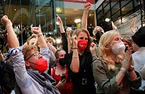 Supporters react after German parliament election at the Social Democratic Party, SPD, headquarters in Berlin, Sunday, Sept. 26, 202