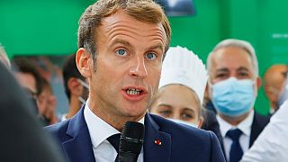 French President Emmanuel Macron speaks to attendees at the fair in Lyon.
