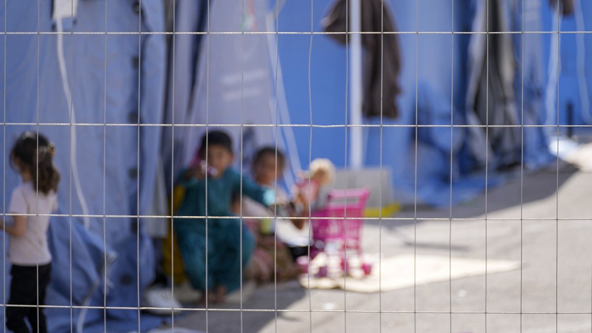 Afghan children play with toys in an Italian Red Cross refugee camp, in Avezzano, Italy, Tuesday, Aug. 31, 2021.
