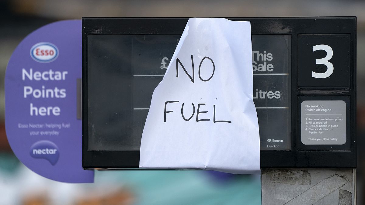 A sign indicating that fuel has run out is seen at a petrol station in Manchester, Sept. 27, 2021.