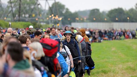 Festival goers arrive for the Glastonbury Festival at Worthy Farm, Somerset, England.