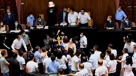 Taiwanese lawmakers brawl during a political speech