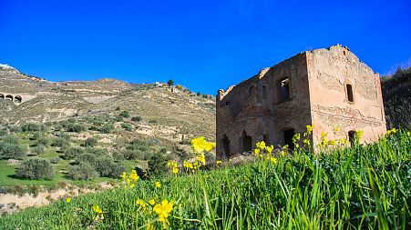A single dilapidated house in the Italian countryside.