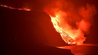 Lava from a volcano reaches the sea on the Canary island of La Palma, Spain in the early hours of Wednesday Sept. 29, 2021.