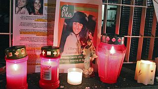 Candles, photos of Eluana are seen in Udine, Italy, on Feb. 10, 2009, after the death of Eluana Englaro, 38, in vegetative state since a car crash 17 years ago