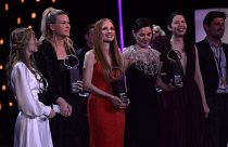 U.S. actress Jessica Chastain, center dressing red, poses with other winners after receiving an ex-aequo Donostia Shell award at the San Sebastian Film Festival.