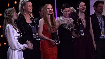 U.S. actress Jessica Chastain, center dressing red, poses with other winners after receiving an ex-aequo Donostia Shell award at the San Sebastian Film Festival.