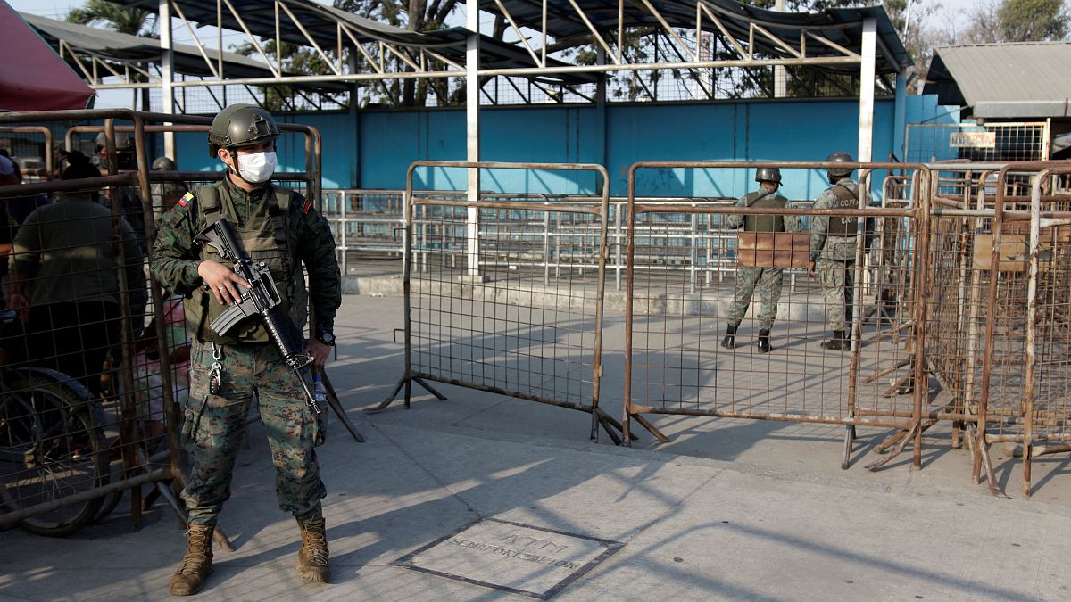 Soldiers guard the entrance to the Litoral Penitentiary a day after a deadly riot, in Guayaquil, Ecuador