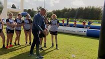 Duke and Duchess of Cambridge kick rugby balls while visiting Northern Ireland