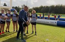 Duke and Duchess of Cambridge kick rugby balls while visiting Northern Ireland
