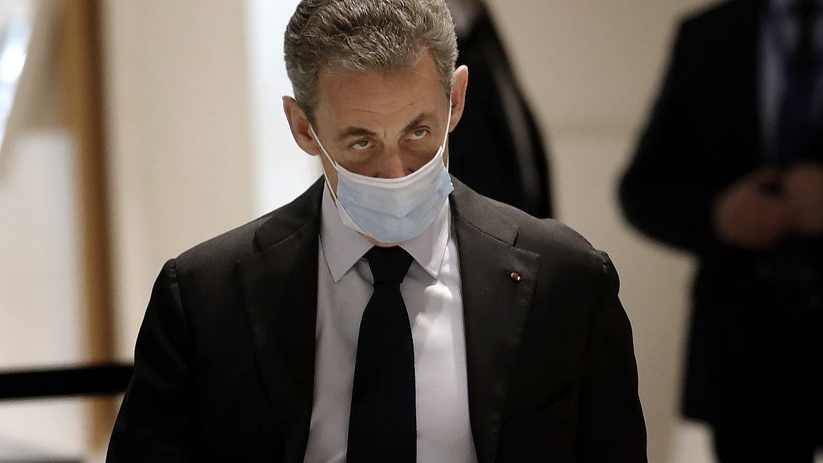 Former French President Nicolas Sarkozy arrives at the courtroom Monday, Nov. 30, 2020 in Paris.