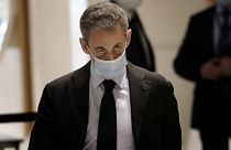 Former French President Nicolas Sarkozy arrives at the courtroom Monday, Nov. 30, 2020 in Paris.