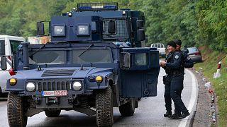 Kosovo police secure the area as Ethnic Serbs gathered on barricades near the northern Kosovo border crossing of Jarinje on the ninth day of protest, Sept. 28, 2021