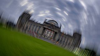Picture taken while turning the camera shows the Reichstag building with the German parliament in Berlin, Germany, Sunday, Sept. 26, 2021.