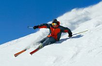 Man skis down a mountain 