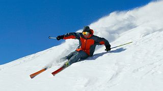Man skis down a mountain 