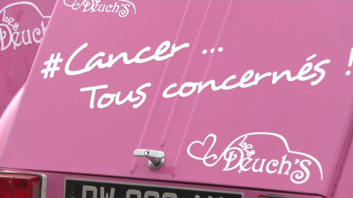 A French charity undertaking a road trip through the country to spread awareness uses pink 2CVs reading "#Cancer... Tous concernés!" (#AllConcerned). 