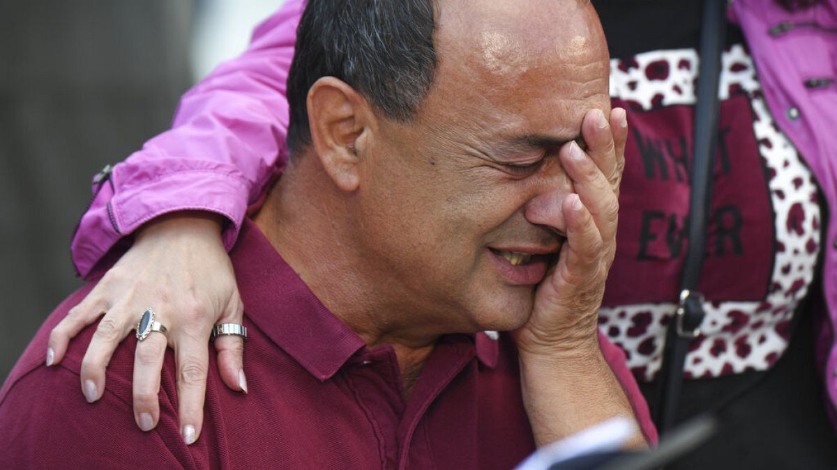 Domenico "Mimmo" Lucano gets emotional during a demonstration in his support in Riace, Friday Oct.1, 2021.