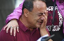 Domenico "Mimmo" Lucano gets emotional during a demonstration in his support in Riace, Friday Oct.1, 2021.