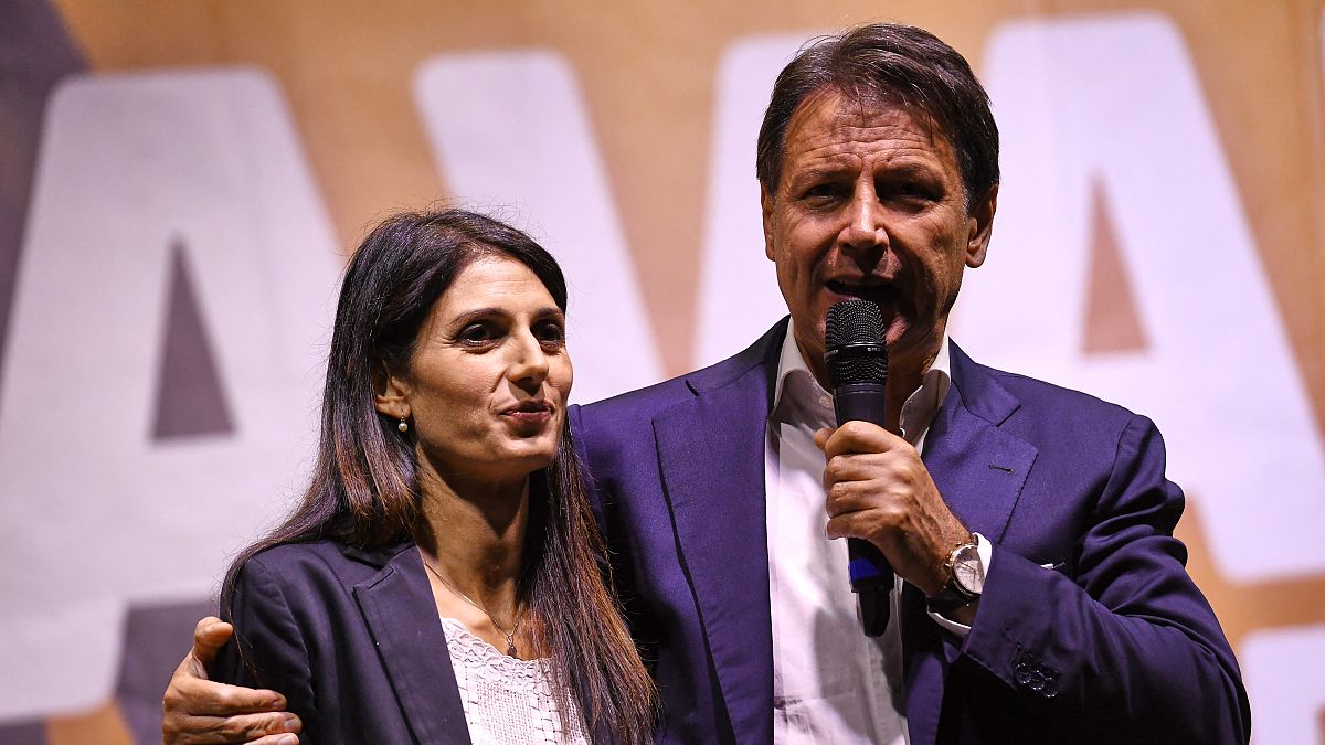 Incumbent Rome mayor and fellow Five Star movement member, Virginia Raggi (L) with ex-Italian prime minister Giuseppe Conte, during a campaign rally in Rome, October 1, 2021.