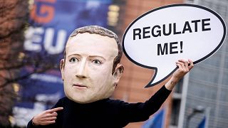 Activists called for the EU to regulate Facebook during a demonstration in December last year