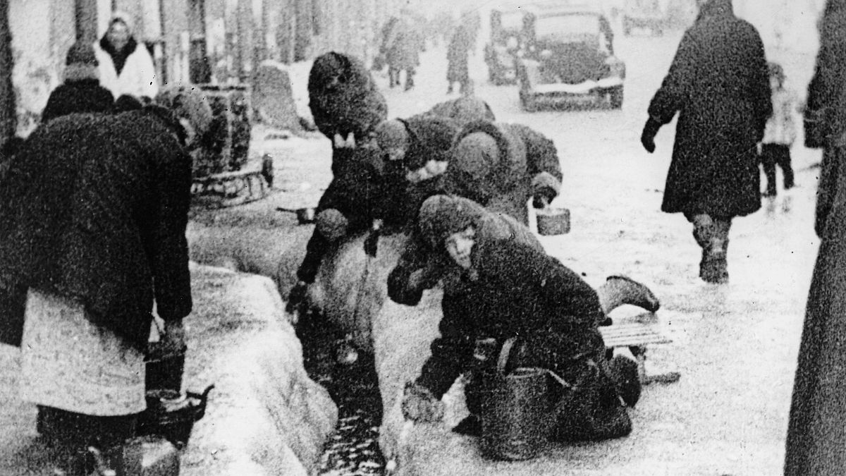  This file photo, taken in 1942, shows citizens of Leningrad as they dig up water from a broken main, during the 900-day siege of the Russian city by German invaders