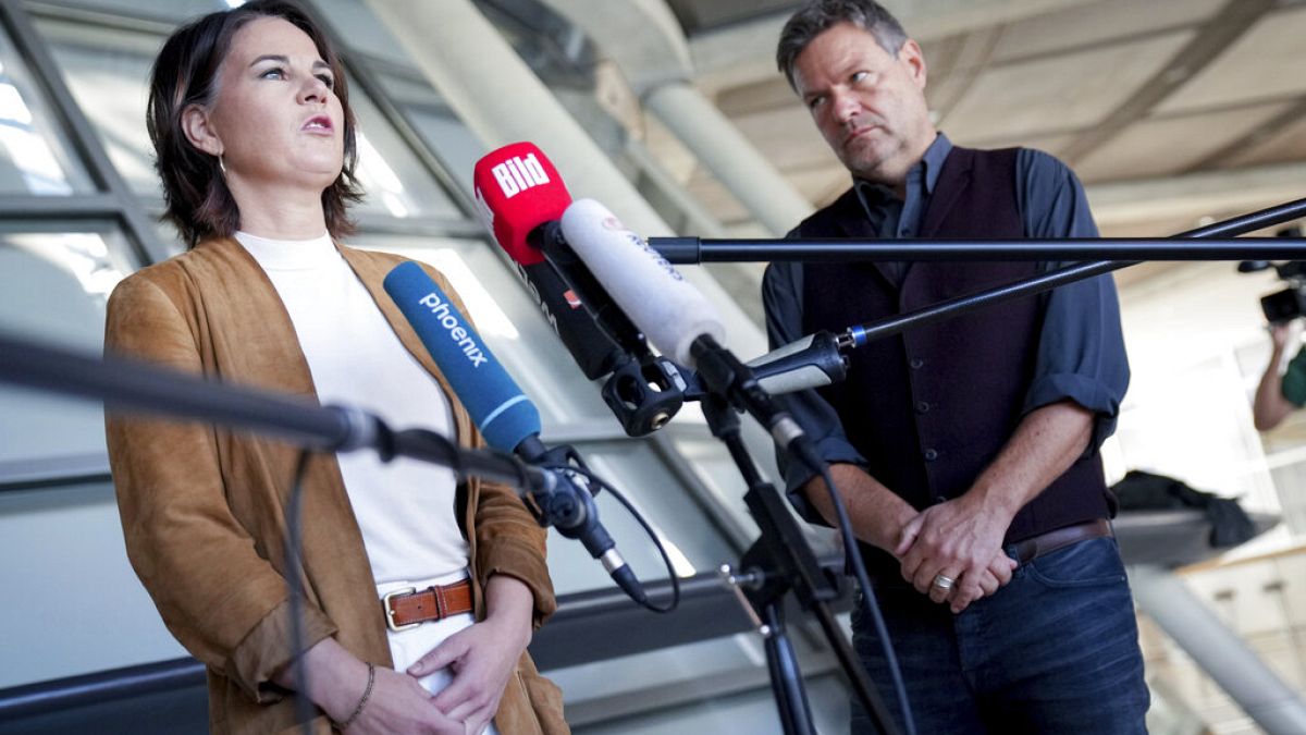 Annalena Baerbock, left, co-chairwoman of the German Green party (Die Gruenen), and Robert Habeck, the party's co-chairman, give a press conference on coalition talks