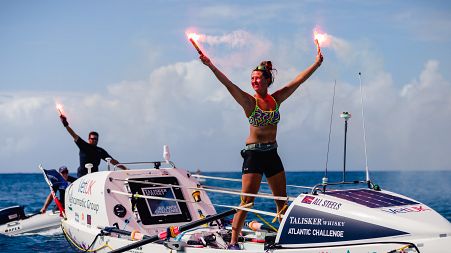 Jasmine at the finish line in Antigua, having rowed over 5,000 kilometres