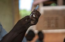 Health officials prepare to vaccine residents of the Malawi village of Tomali.