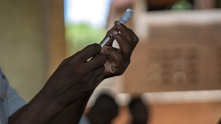 Health officials prepare to vaccine residents of the Malawi village of Tomali.