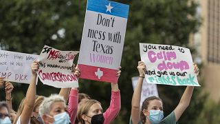 People take part in the Women's March ATX rally, Saturday, Oct., 2, 2021 in at the Texas State Capitol in Austin, Texas, United States.
