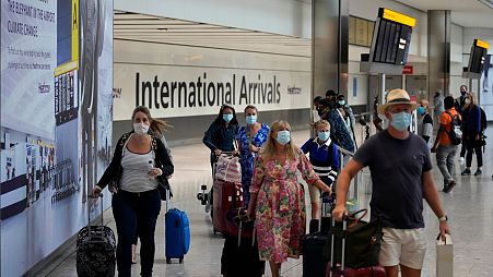 Passengers arriving into Heathrow Airport in London.