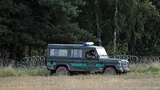 Polish border guards monitor an area along the border with Belarus in Usnarz Gorny.