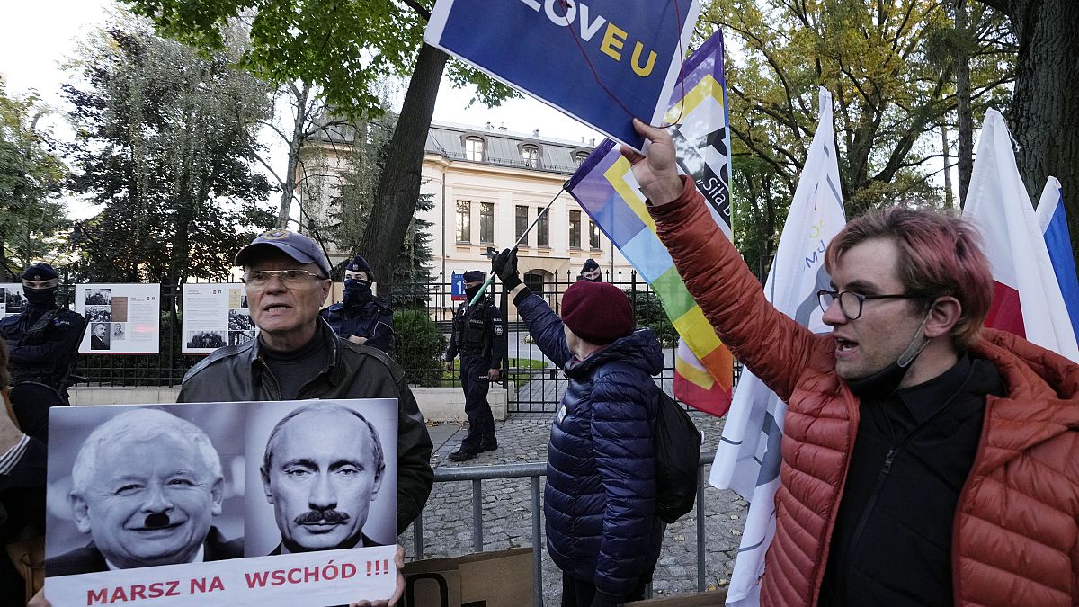 People stage a protest in front of Poland's constitutional court, in Warsaw, Poland, Thursday, October 7, 2021.