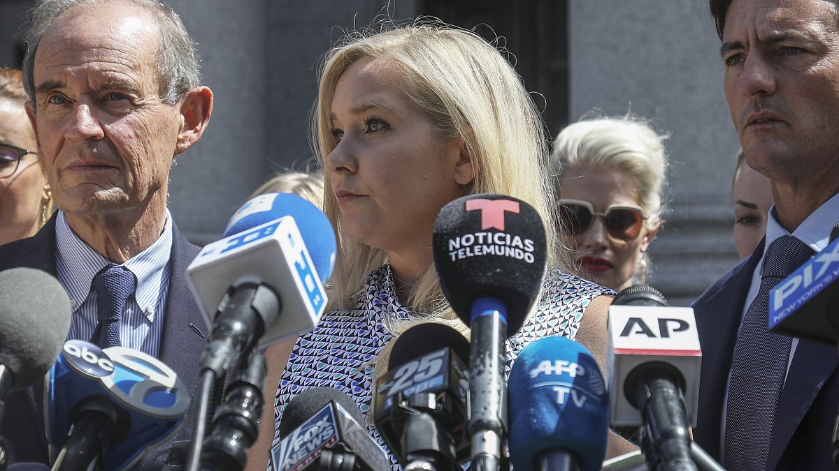 In this file photo from 2019, Virginia Giuffre, who says she was trafficked by sex offender Jeffrey Epstein, holds a news conference outside a Manhattan court in New York.