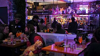 Patrons eat and drink inside a bar in Sydney on October 11, 2021, as Sydney ended their lockdown against the Covid-19 coronavirus after 106 days.